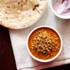 matki usal served in a white bowl.