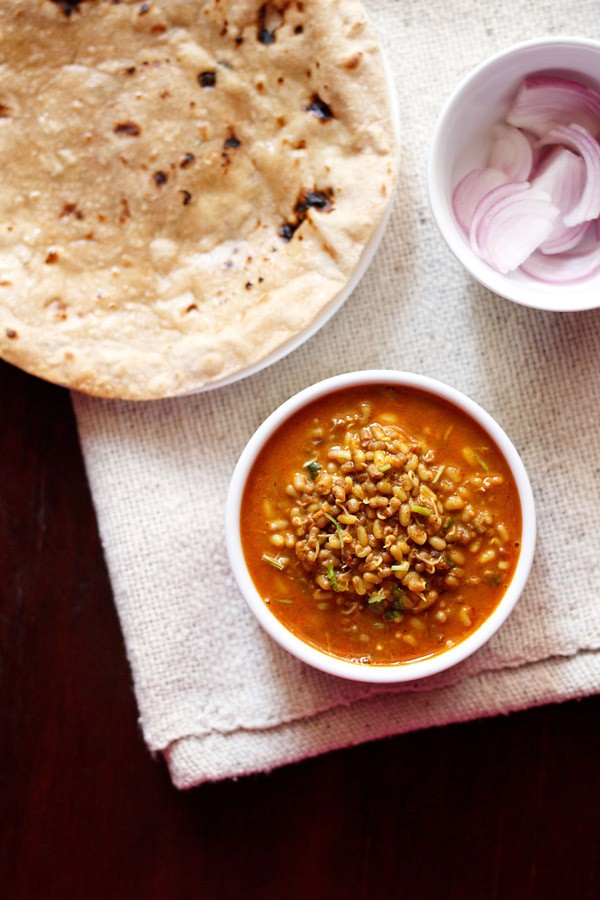 matki usal served in a white bowl.