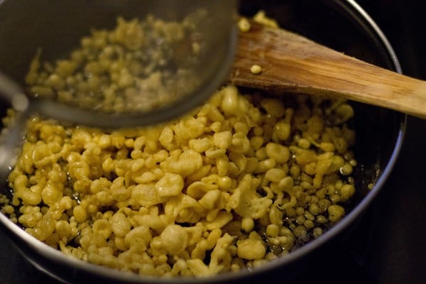 fried boondi added to sugar syrup