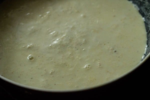 making rabri requires low and slow cooking - this simmering, lightly textured milk isn't ready yet