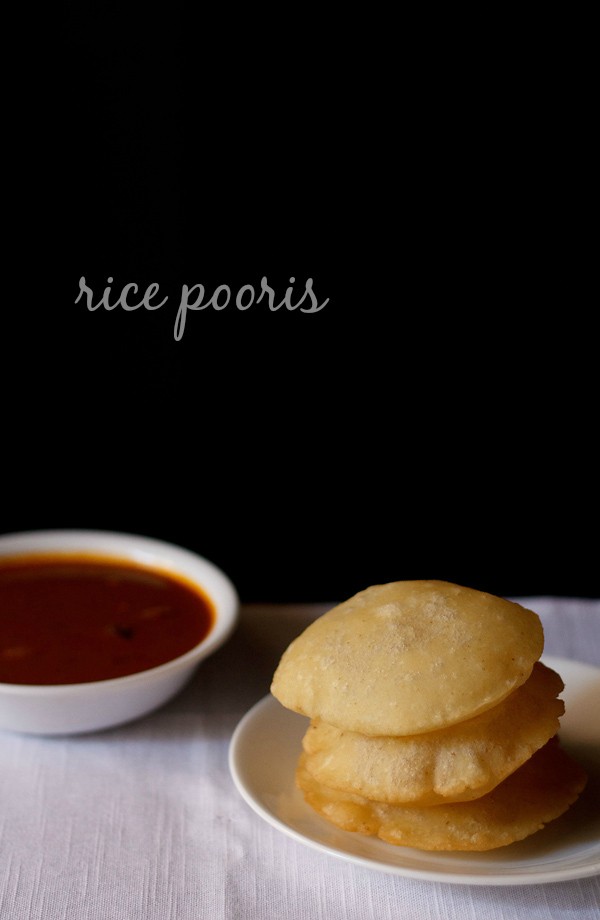rice puri or rice vada kept on top of each other and served on a white plate with a bowl of curry kept on the left side and text layovers. 