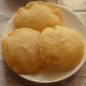 rice vada or rice puri on a white plate