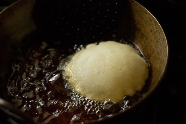 puffed rice puri in hot oil. 