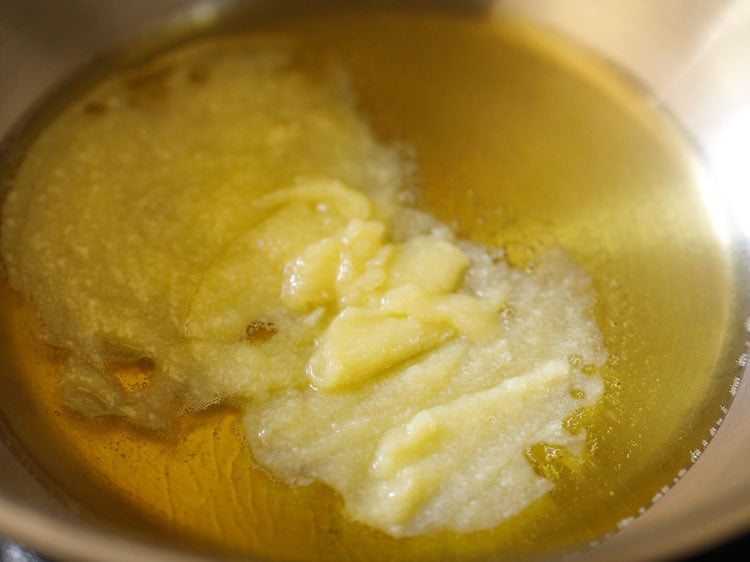 heating ghee in a heavy pan or kadai