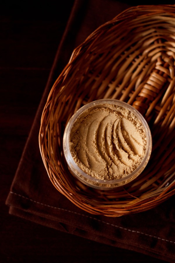 amchur powder, amchoor powder or dry mango powder in a jar. 