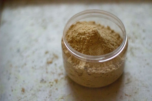 amchur powder, amchoor powder or dry mango powder in a jar. 
