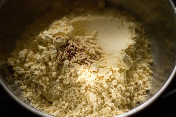 ingredients for boondi ladoo batter in a bowl