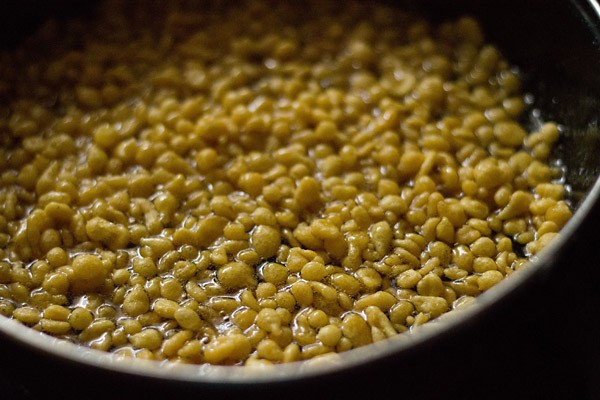 fried boondi soaking in sugar syrup