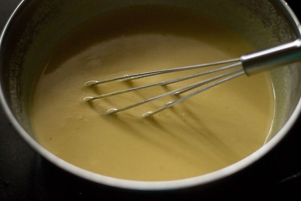 batter with a whisk inside in bowl