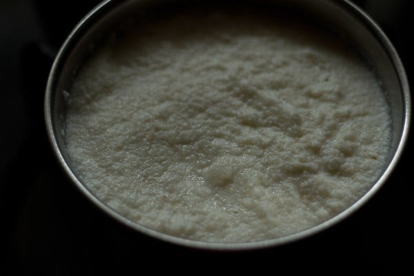 milk soaked dry coconut in a bowl.