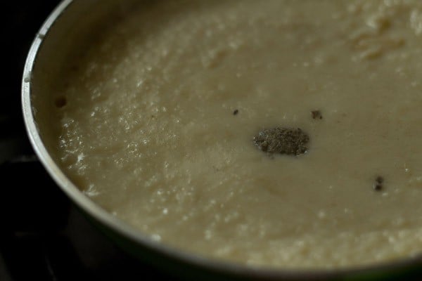 adding cardamom powder to the mixture.