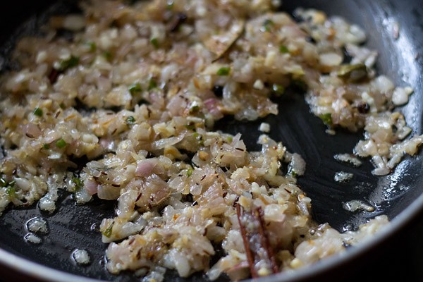 sautéing onion mixture in pan. 