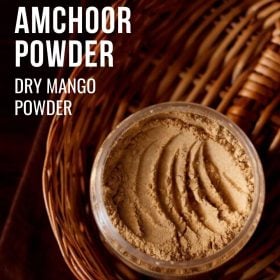amchoor powder in a jar with text layovers
