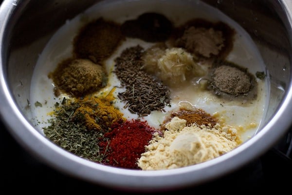 add spices - making paneer tikka