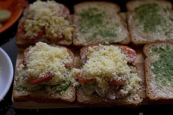 grated cheese on bread slices