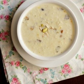 paneer kheer served in a white bowl.