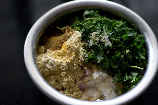 gram flour, finely chopped onion, finely chopped ginger, chopped green chili, chopped coriander leaves, spices and salt added to the cooked rice. 