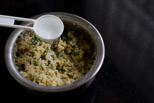 adding water to the cooked rice mixture. 