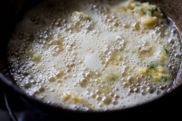 frying chawal ke pakode in hot oil. 