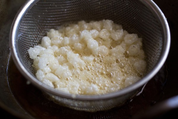 Fry nylon sabudana pearls to make sabudana namkeen. 