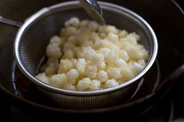 Fried nylon sabudana pearls used to make sabudana namkeen. 