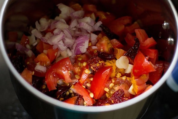 ingredients added to a wet grinder jar for making paste. 