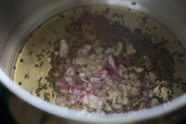 sautéing onions in the hot oil. 