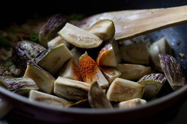 drained brinjals and turmeric powder added to the spice mixture. 