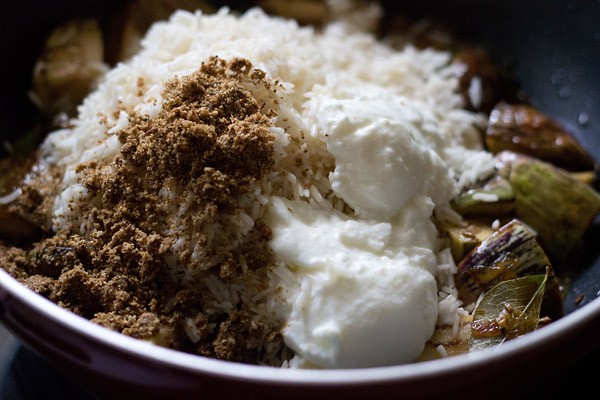 soaked rice, prepared goda masala powder and curd added to the brinjals. 