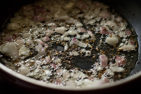 sautéing finely chopped onions in hot oil. 