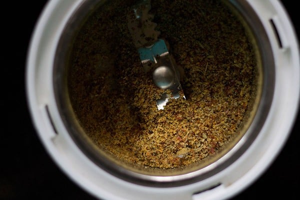 Ground Achari Masala in the grinder jar