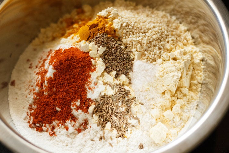 adding spices and seasonings to the flours