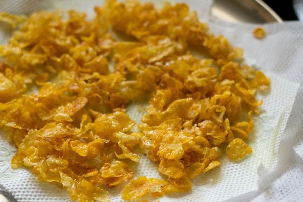 fried cornflakes placed on kitchen paper towel. 