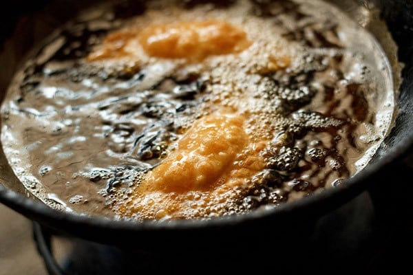 frying gujiya in hot oil