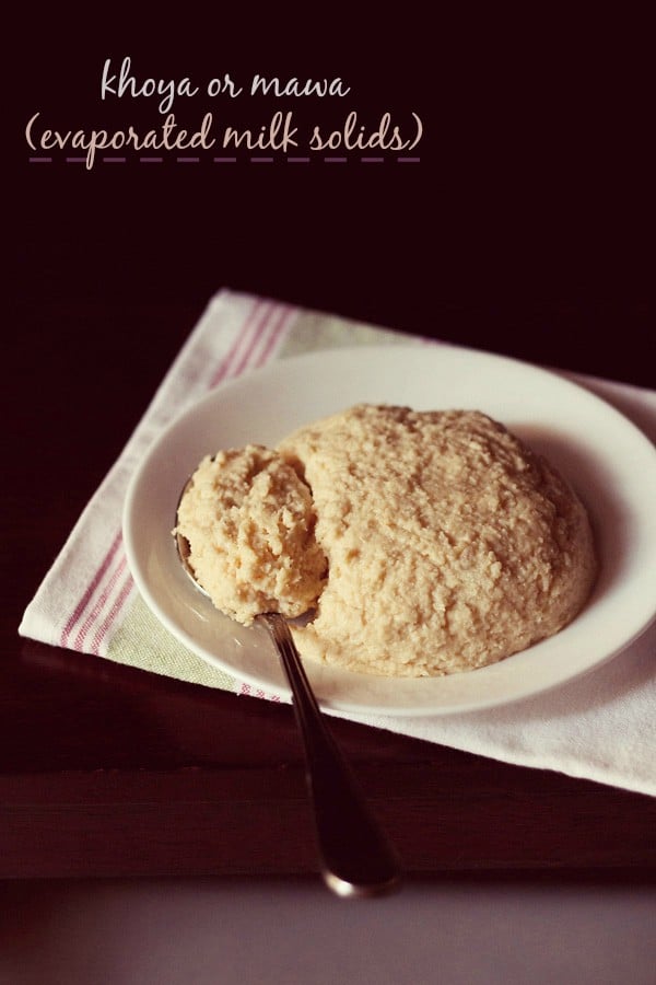 khoya in a white plate with a spoon on a white napkin with text layovers.