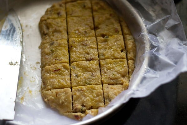 set burfi mixture cut into squares. 