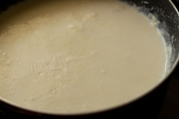 stir milk and add the solids back to the pan. 