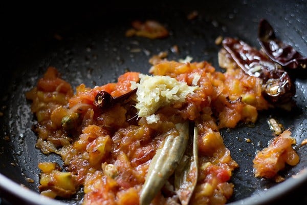 ginger-garlic paste added on top of the tomatoes