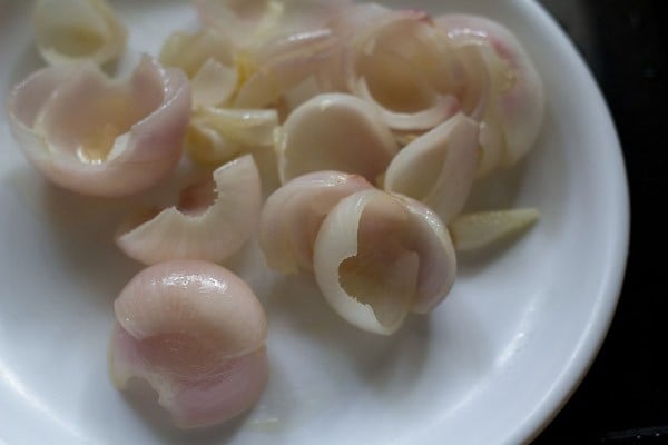 sautéed onion layers set aside in a white plate