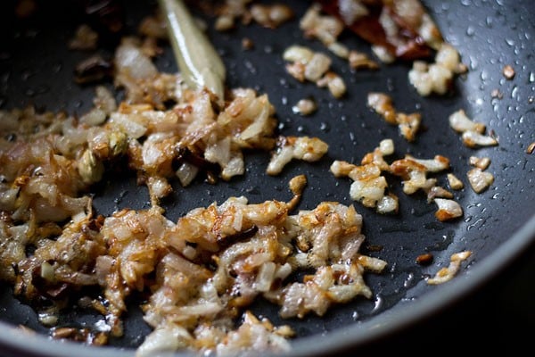 onions golden or caramelized in the pan for making paneer do pyaza recipe