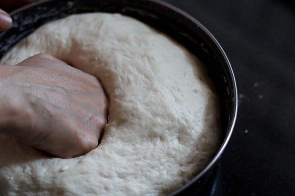 punching the risen dough. 