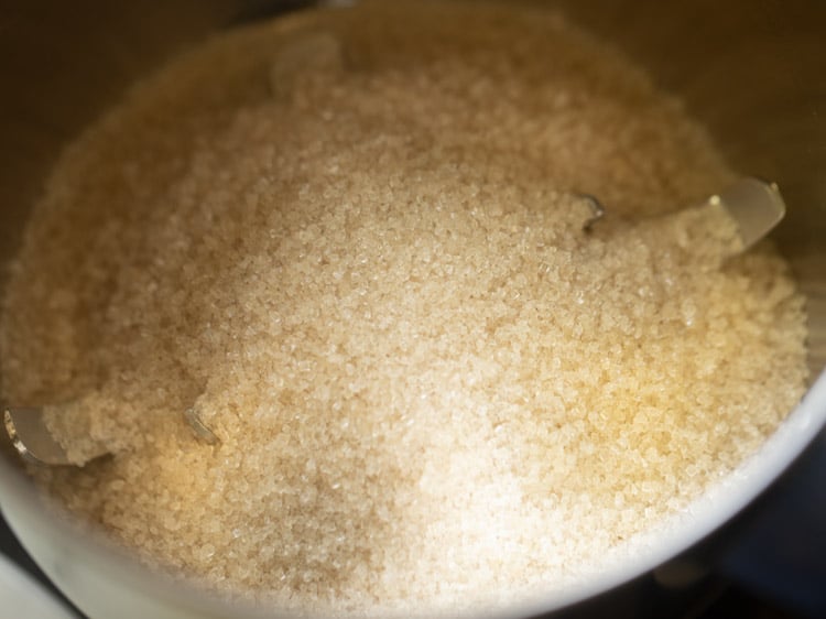 sugar added in a grinder or blender jar for making suji ke laddu. 