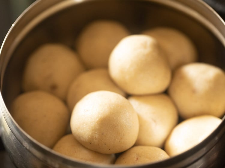 suji ke laddu placed in a steel container.