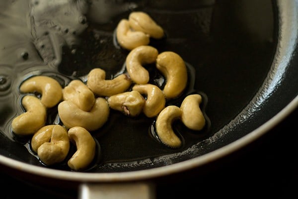 frying cashews in the pan