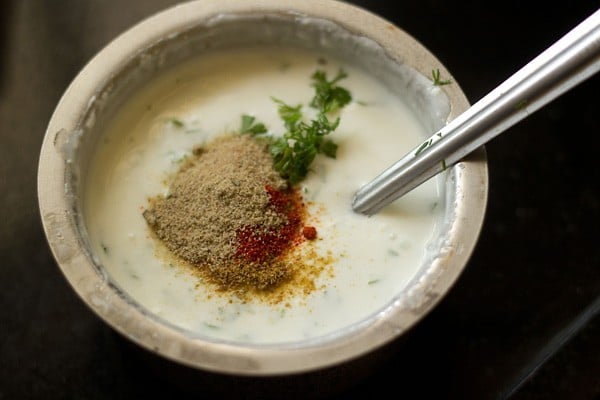 curd, roasted cumin powder, red chili powder, chaat masala, sugar, and coriander leaves in a bowl