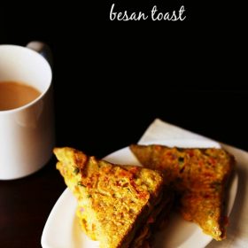 besan bread toast served on a white plate with a cup of tea kept on the left side in the background and text layover.