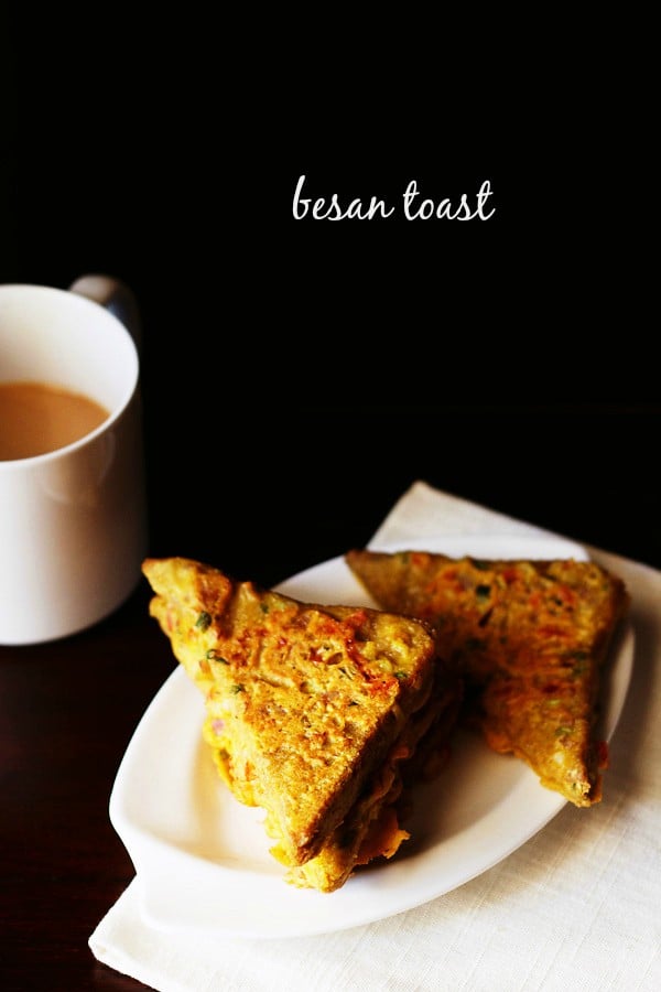besan bread toast served on a white plate with a cup of tea kept on the left side in the background and text layover.