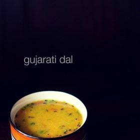 Gujarati dal in a black rimmed ceramic bowl on a black background