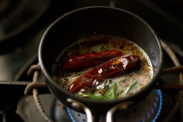 spices and herbs frying in oil