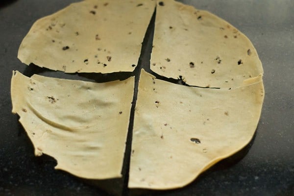 papad broken into 4 pieces. 